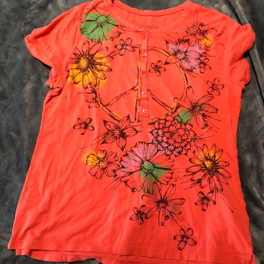 Orange Top with a Peace Sign Design